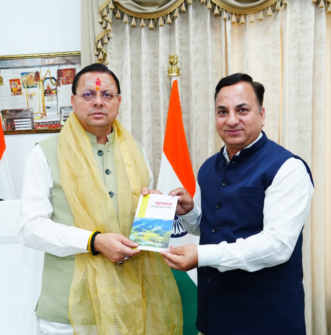 Joint Director, Information, KS Chauhan presents CM with copy of